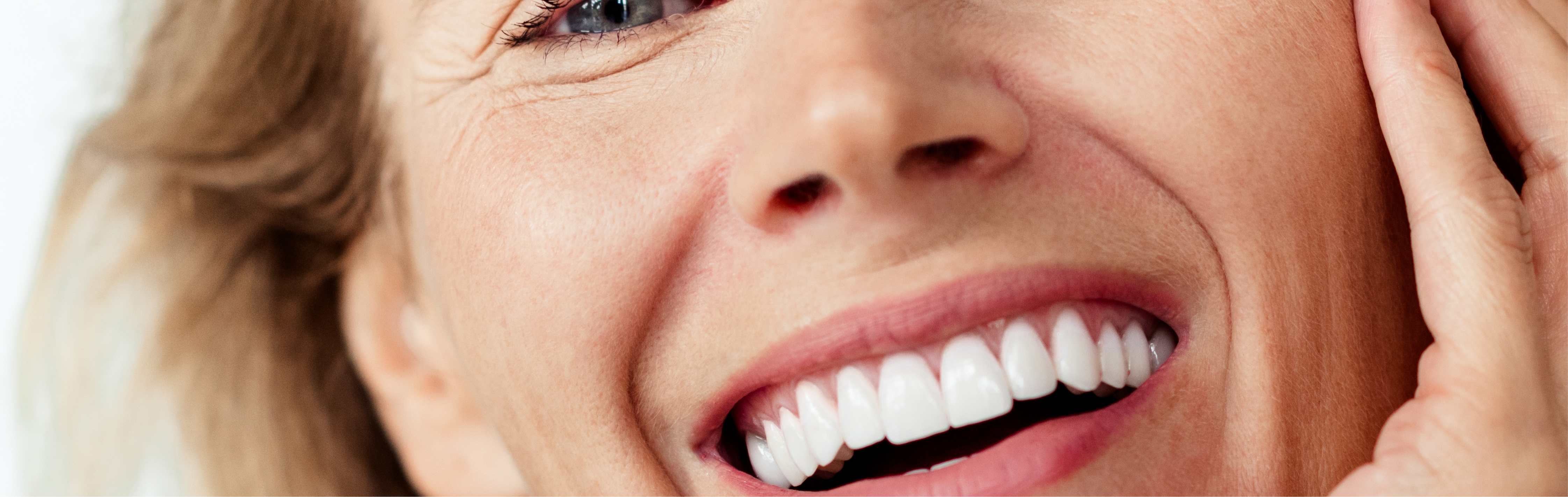 Southern Face and Body lady facing the camera close up of her face with smooth skin while smiling