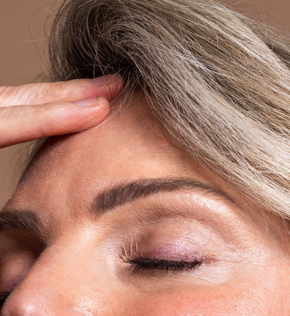 Southern Face and Body lady facing the camera close up of her forehead with smooth skin
