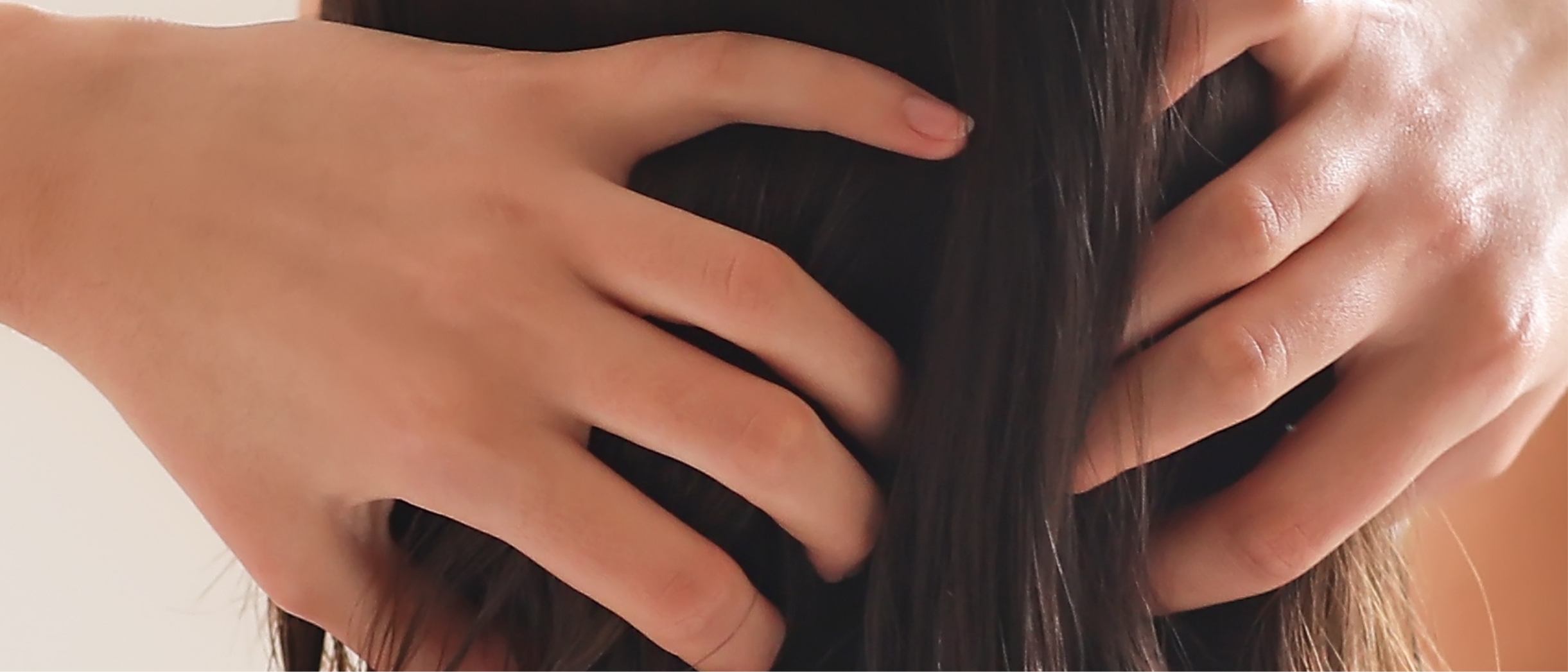 Southern Face and Body lady facing away from the camera close up of her head with dark hair